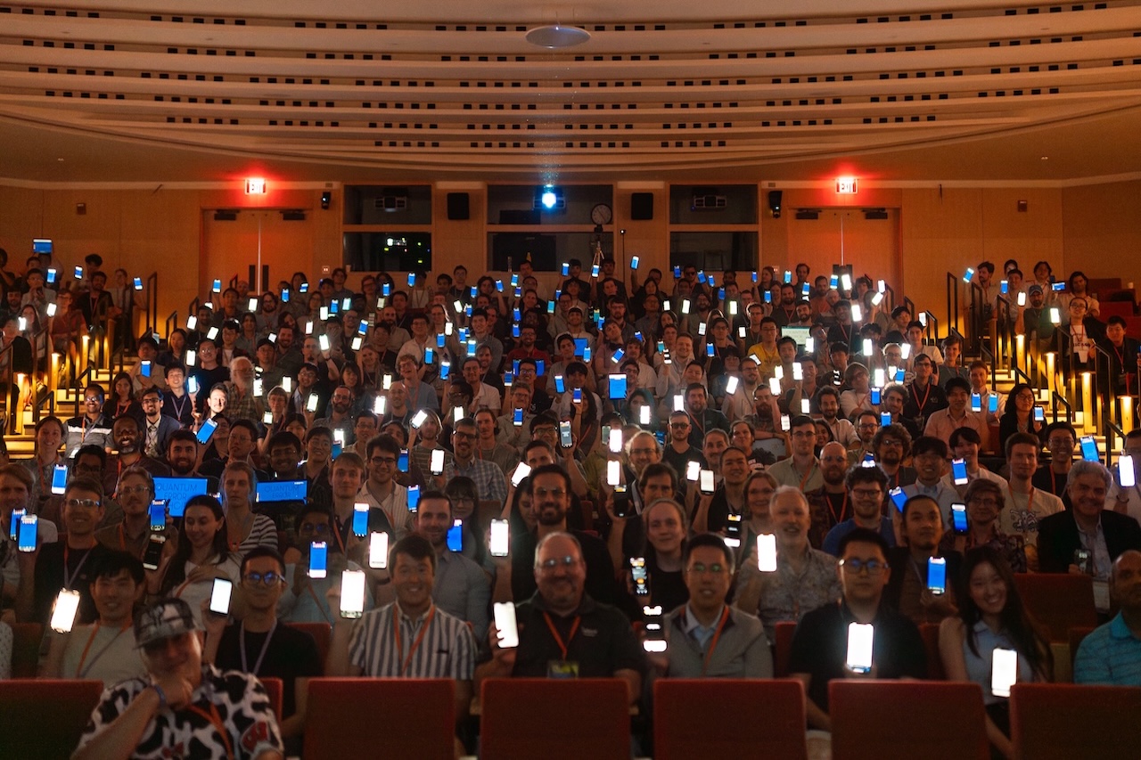 Attendees showing their phone